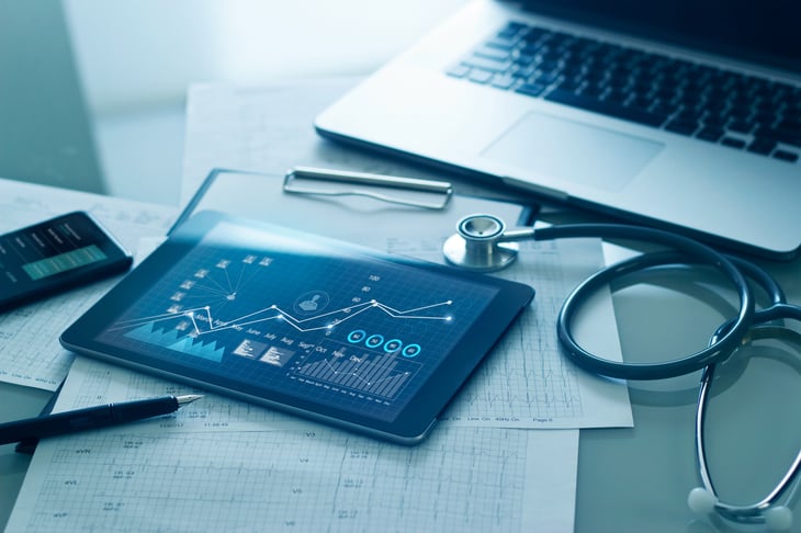 Healthcare-business-concept,-Medical-examination-and-growth-graph-data-of-business-on-tablet-with-doctors-health-report-clipboard-on-background--1274428125_5000x3333-jpeg-1